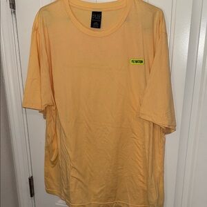 P.E Nation Women's Short Sleeve In Play Tee in Soft Golden Sand